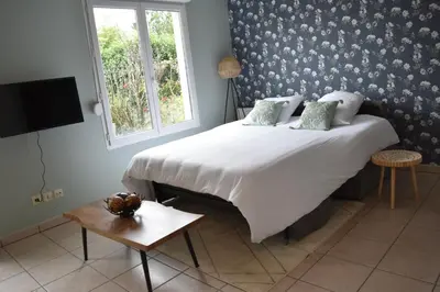 Un ou plusieurs lits dans un hébergement de l'établissement L'Aquarelle - Appartement cosy, GroupamaStadium LDLC Arena