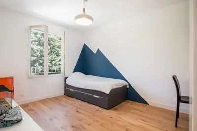 Un ou plusieurs lits dans un hébergement de l'établissement La Saulière - Family house with zen and trendy decoration