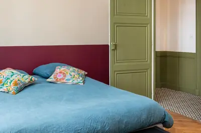 Un ou plusieurs lits dans un hébergement de l'établissement L'Authentique - Appartement en coeur de ville