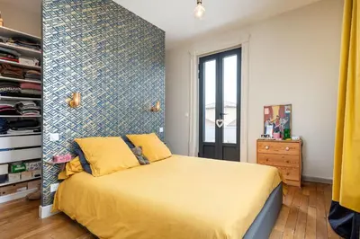 Un ou plusieurs lits dans un hébergement de l'établissement Le Marronnier - charming house with swimming pool