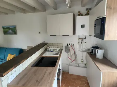 Cuisine ou kitchenette dans l'établissement Maison de charme, Maison carrée