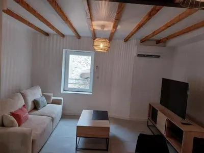 Télévision ou salle de divertissement dans l'établissement Appartement cosy et calme