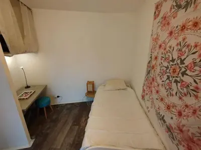 Un ou plusieurs lits dans un hébergement de l'établissement HOMEYPIC T3 en rez de jardin proche de Lyon