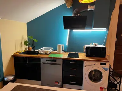 Cuisine ou kitchenette dans l'établissement Bonheur