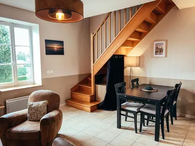 Coin salon dans l'établissement Appartement duplex chaleureux au calme