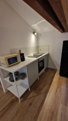 Cuisine ou kitchenette dans l'établissement Le Bourg