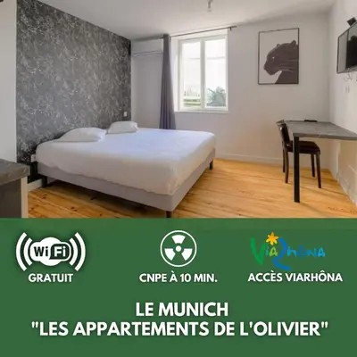 Un ou plusieurs lits dans un hébergement de l'établissement Le Munich - Les appartements de l'olivier