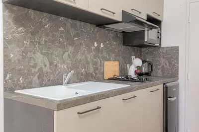 Cuisine ou kitchenette dans l'établissement Le Nuremberg - Les appartements de l'olivier