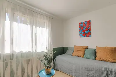 Un ou plusieurs lits dans un hébergement de l'établissement Le Florence - Studio Grange Blanche