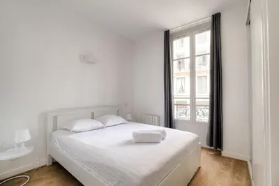 Un ou plusieurs lits dans un hébergement de l'établissement Appartement cosy rénové, Hyper-centre Lyon