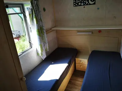 Un ou plusieurs lits dans un hébergement de l'établissement Bungalow camping 3 étoiles