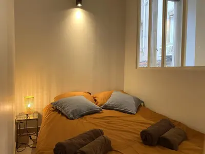 Un ou plusieurs lits dans un hébergement de l'établissement Le Saint-Georges, BNBConciergerie