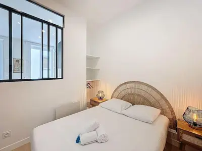 Un ou plusieurs lits dans un hébergement de l'établissement Cosy appartement, Lyon Centre Capucins 1