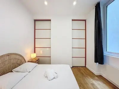 Un ou plusieurs lits dans un hébergement de l'établissement Cosy appartement, Lyon Centre Capucins 2