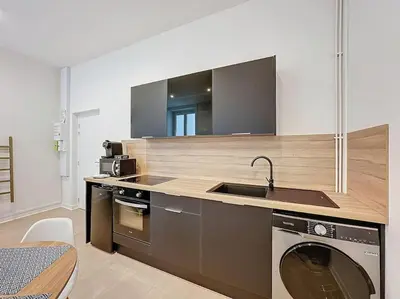 Cuisine ou kitchenette dans l'établissement Cosy appartement, Lyon Centre Capucins 2