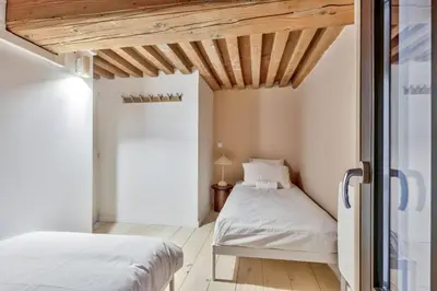 Un ou plusieurs lits dans un hébergement de l'établissement NOCNOC Le Boudoir