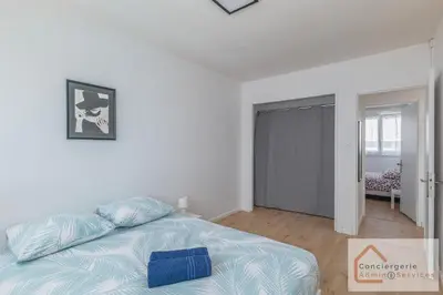 Un ou plusieurs lits dans un hébergement de l'établissement La Belle Escale - appartement lumineux à proximité d'Eurexpo