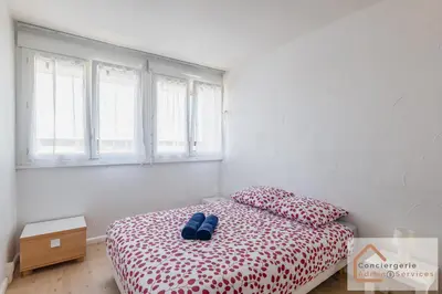 Un ou plusieurs lits dans un hébergement de l'établissement La Belle Escale - appartement lumineux à proximité d'Eurexpo