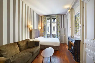 Un ou plusieurs lits dans un hébergement de l'établissement Hôtel Vaubecour - Centre Lyon Ainay - Perrache