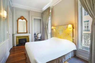 Un ou plusieurs lits dans un hébergement de l'établissement Hôtel Vaubecour - Centre Lyon Ainay - Perrache