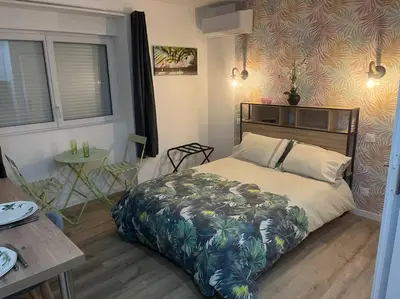 Un ou plusieurs lits dans un hébergement de l'établissement VERDI studio COSY au calme parking gratuit