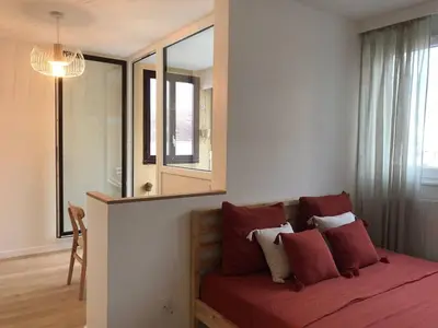 Un ou plusieurs lits dans un hébergement de l'établissement Le Studio Lumière - Balcony - 5min Part-Dieu