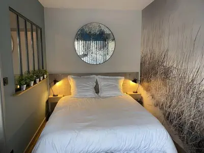 Un ou plusieurs lits dans un hébergement de l'établissement Studio lumineux avec balcon proche Tête d'Or