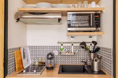Cuisine ou kitchenette dans l'établissement Milan, centre historique et climatisé, Lyon 1er
