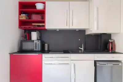 Cuisine ou kitchenette dans l'établissement Appartement fonctionnel et bien situé, coeur 6ème