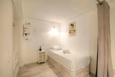 Un ou plusieurs lits dans un hébergement de l'établissement Happy Days, 150m2 de divertissement, Lyon 7