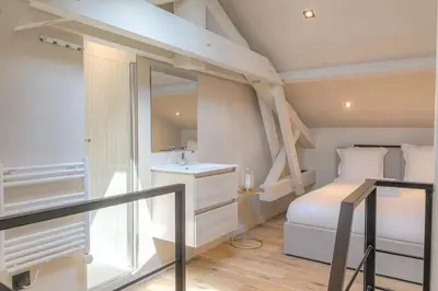 Un ou plusieurs lits dans un hébergement de l'établissement Studio moderne et équipé en duplex, Villeurbanne