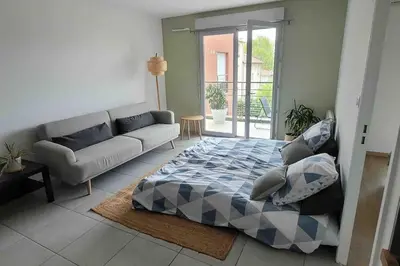 Un ou plusieurs lits dans un hébergement de l'établissement Un balcon à Monplaisir- 4 lits -garage - 47m2