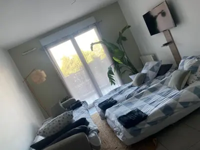 Un ou plusieurs lits dans un hébergement de l'établissement Un balcon à Monplaisir- 4 lits -garage - 47m2