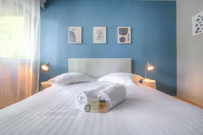 Un ou plusieurs lits dans un hébergement de l'établissement Appartement moderne proche Lyon 6ème