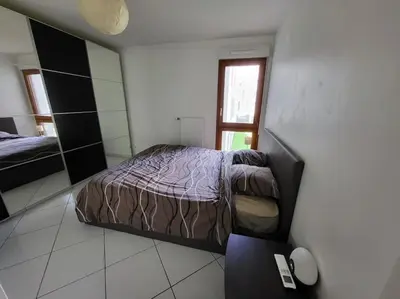 Un ou plusieurs lits dans un hébergement de l'établissement Appartement climatisé et moderne