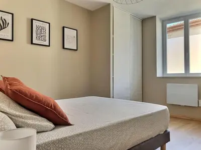 Un ou plusieurs lits dans un hébergement de l'établissement Charmante maison de village