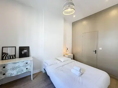 Un ou plusieurs lits dans un hébergement de l'établissement My home Lafayette 3