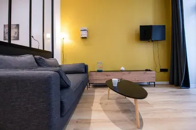 Coin salon dans l'établissement L'Opéra 10 - Beau studio avec balcon - Opéra