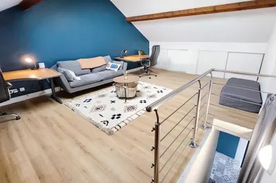 Un ou plusieurs lits dans un hébergement de l'établissement Villa Eurexpo 185m2