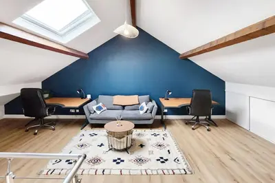 Coin salon dans l'établissement Villa Eurexpo 185m2