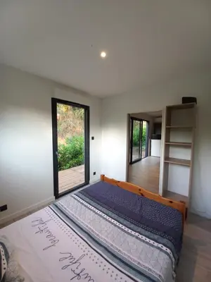 Un ou plusieurs lits dans un hébergement de l'établissement Tiny house dans l'ouest lyonnais