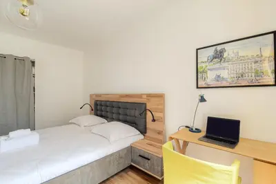 Un ou plusieurs lits dans un hébergement de l'établissement Maison avec terrasse proche Lyon