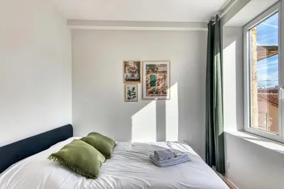 Un ou plusieurs lits dans un hébergement de l'établissement L'Olivier - Cosy studio rénové au coeur de Lyon 5ème