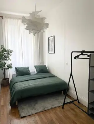 Un ou plusieurs lits dans un hébergement de l'établissement Appartement Brunard