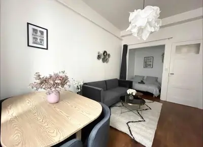 Coin salon dans l'établissement Appartement Brunard