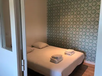 Un ou plusieurs lits dans un hébergement de l'établissement Belle villa proche de Lyon dans le Beaujolais