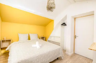 Un ou plusieurs lits dans un hébergement de l'établissement New maison au coeur des vignes