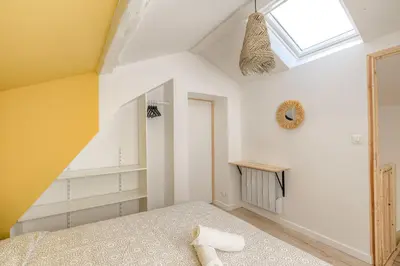 Un ou plusieurs lits dans un hébergement de l'établissement New maison au coeur des vignes