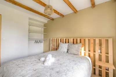 Un ou plusieurs lits dans un hébergement de l'établissement New maison au coeur des vignes