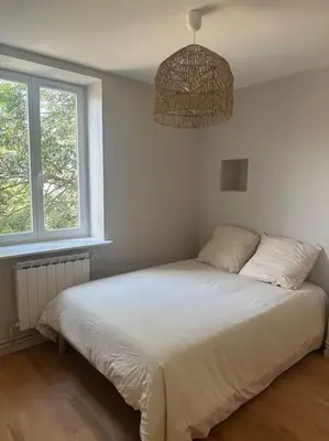 Un ou plusieurs lits dans un hébergement de l'établissement Appartement Brignais Centre en face du pont romain